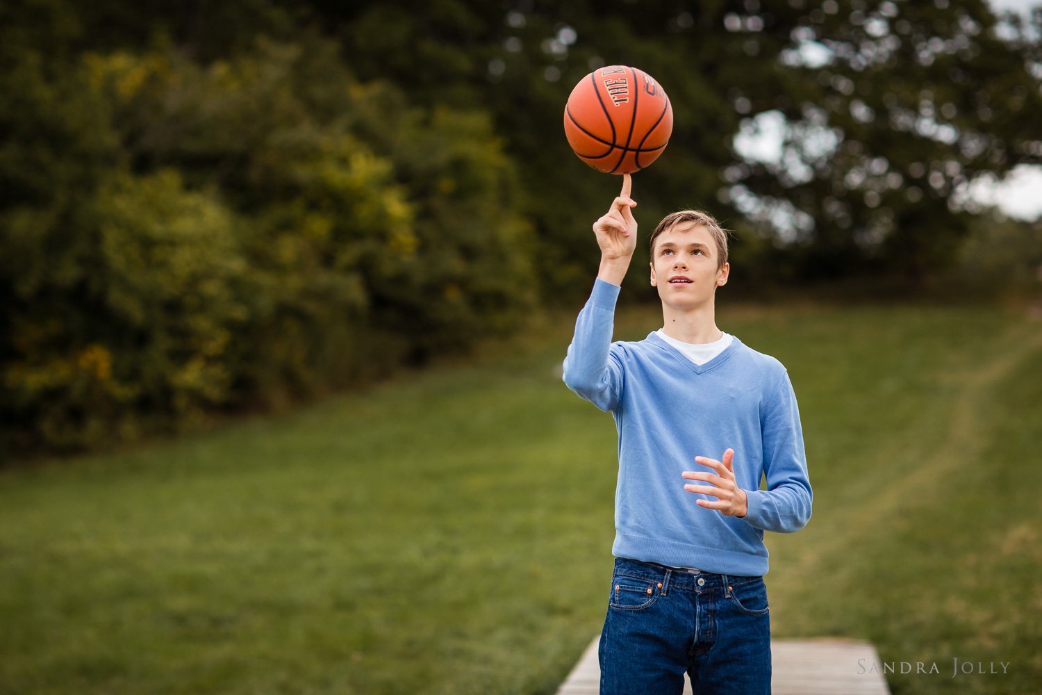 teenage-boy-balancing-basketball-by-sandra-jolly-photography.jpg