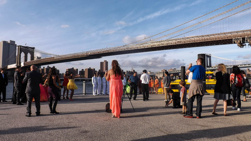 The wedding party draws the attention of tourists and locals 