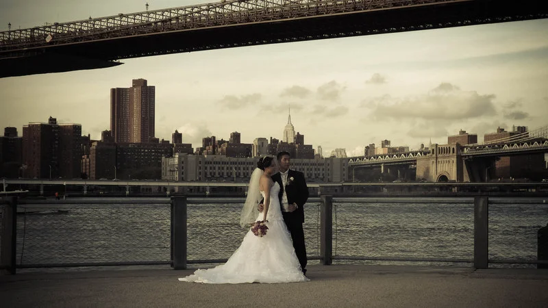 Striking a pose with the Brooklyn Bridge, Manhattan Bridge and Empire State Building in the frame