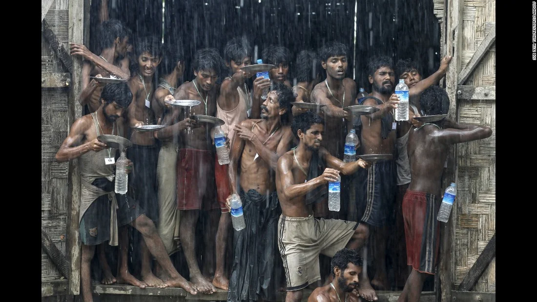5. Migrants who were found at sea collect rainwater at a temporary shelter in Myanmar. Myanmar, which had previously disavowed responsibility for Rohingya migrants stranded at sea, said it would provide search and rescue for “boat people” in it…