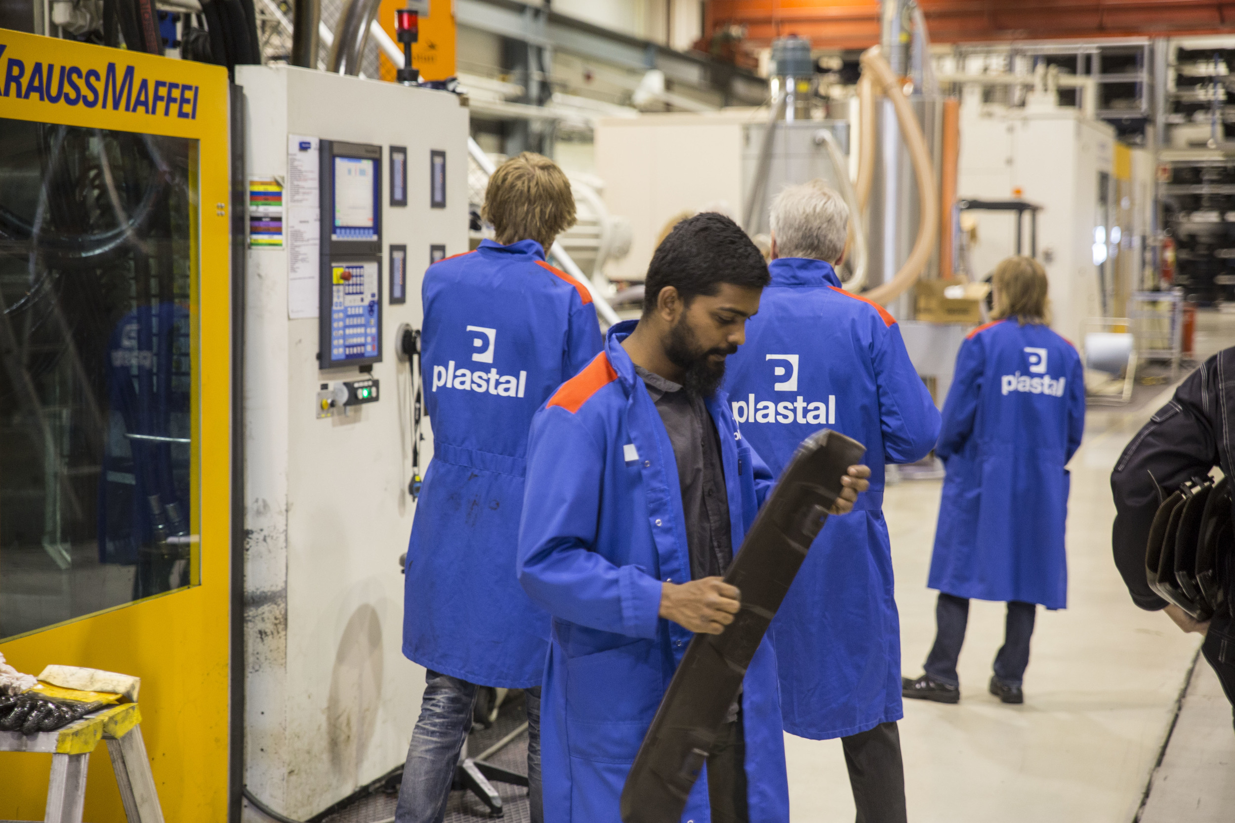 Trifilon's Siddharth Kumaraswamy inspects a bumper insert made using AP21. With two successful trials complete, Trifilon's new lightweight AP21 biocomposite is on track for high volume production. 
