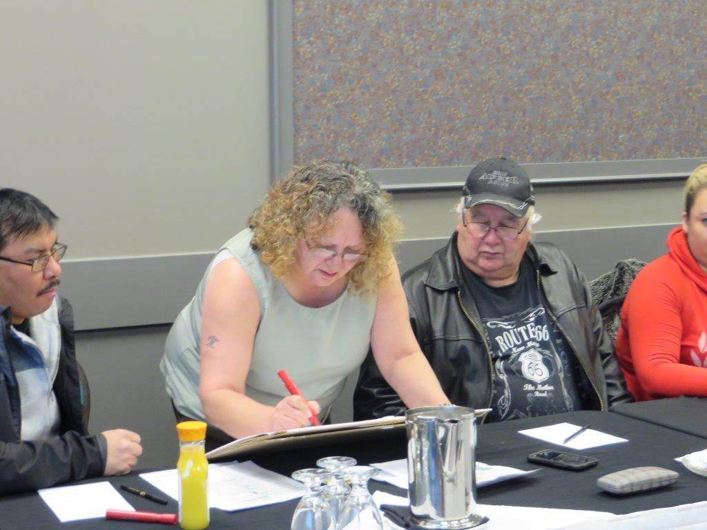  Band Manager Yvonne Buc works with Counsellor Joe Auger and Counsellor Brain Laboucan on their priorities for the 2014/2015 fiscal year. 