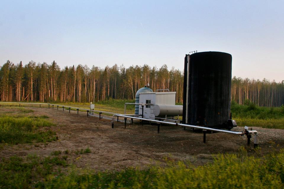 Oil development at the end of a cutline far, far out in the Boreal Forest.