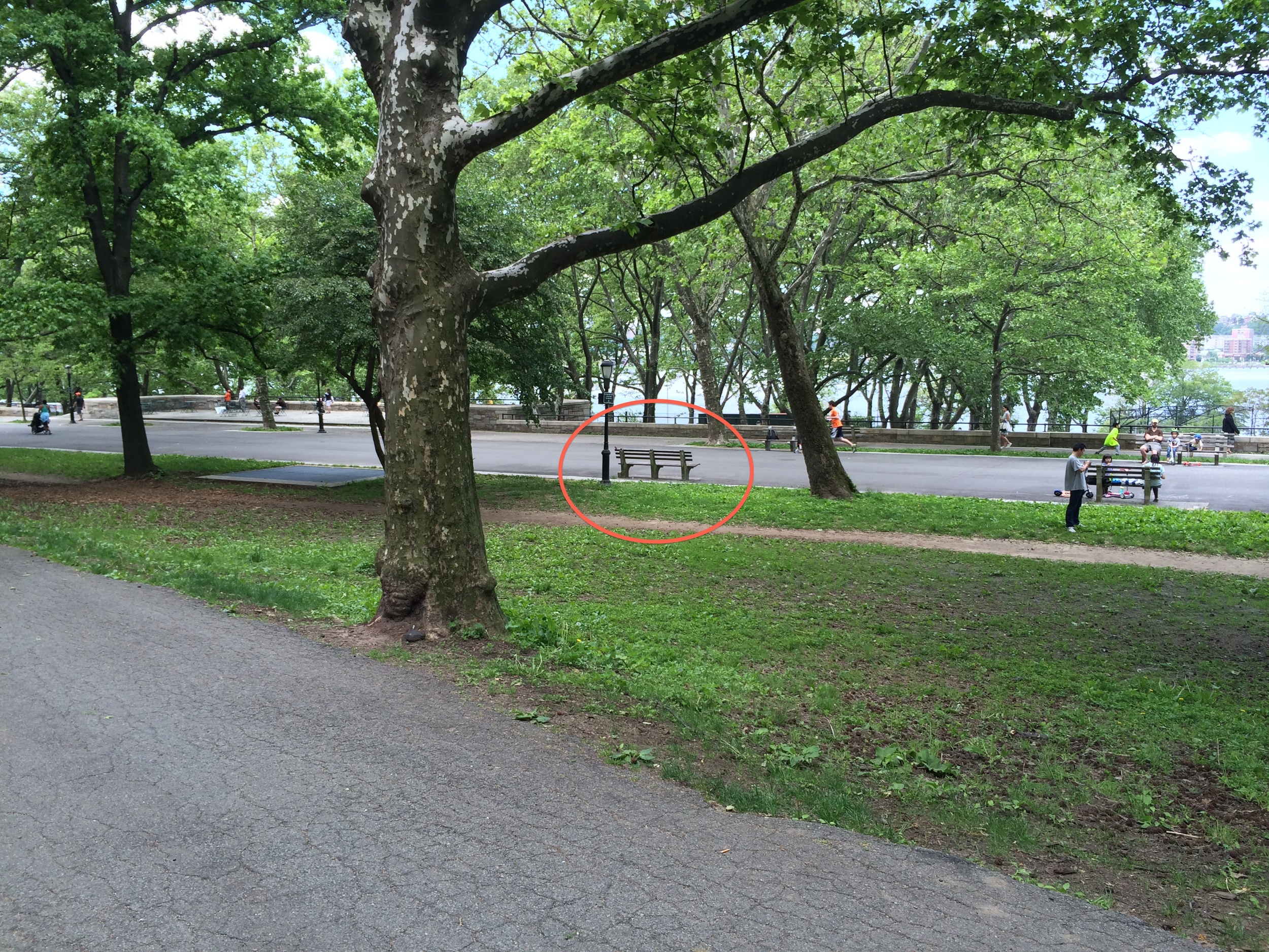 The shrine is the leftmost bench facing the river.