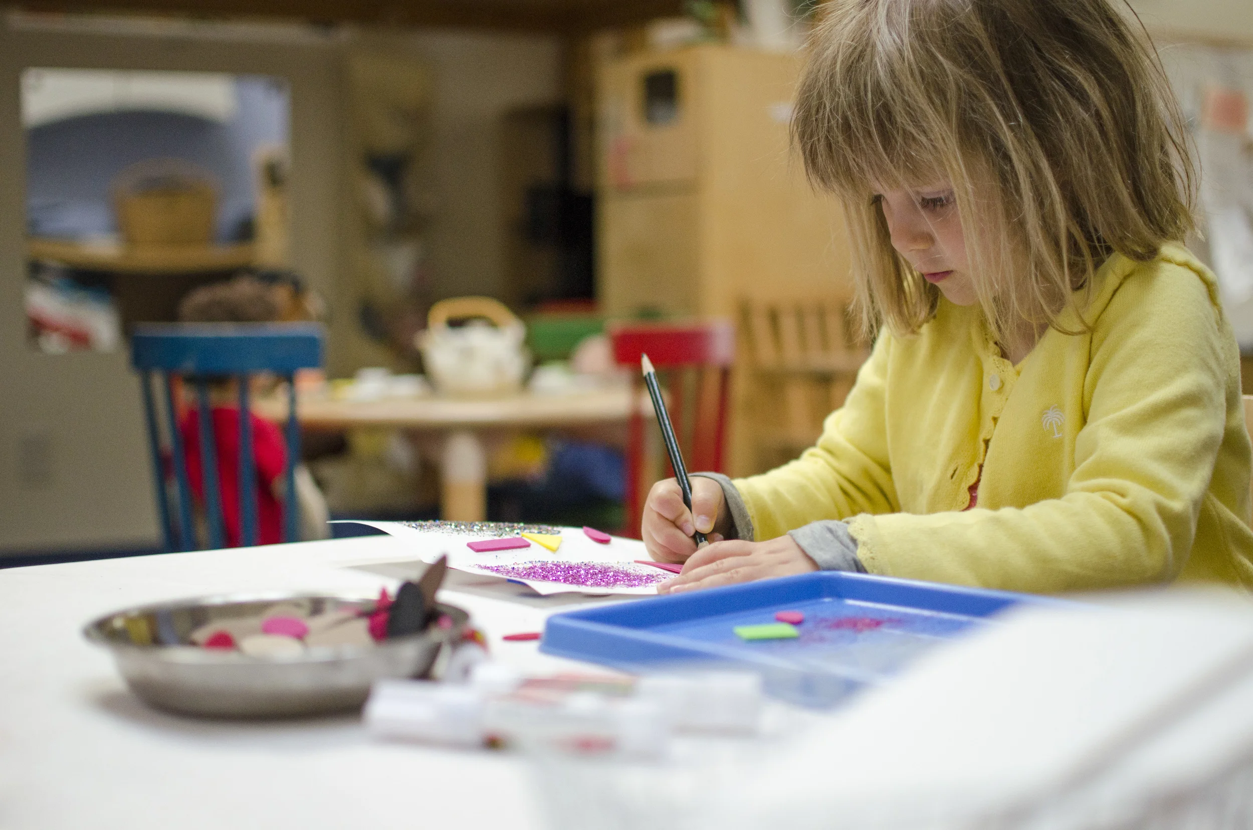 Language development is fostered by offering a wide range of always available tools and activities that encourage children to experiment with the beginning stages of reading and writing.