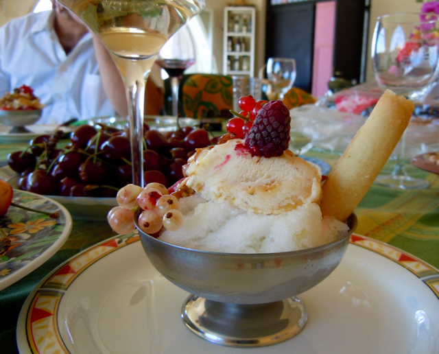Colorful table with fruits grown on at the vineyard and home-made Icecream 