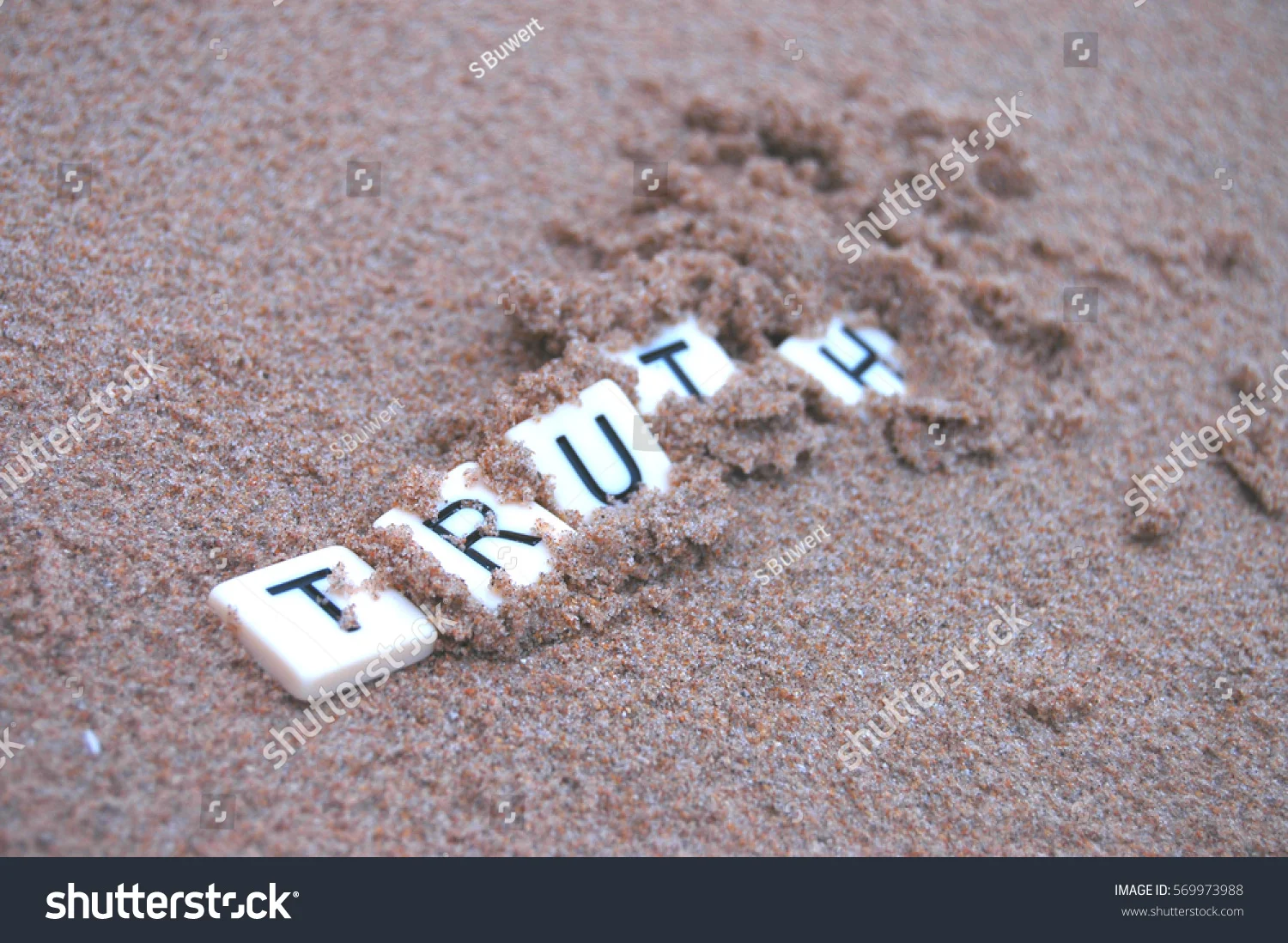 stock-photo-post-truth-letters-spelling-truth-becoming-buried-in-sand-569973988.jpg