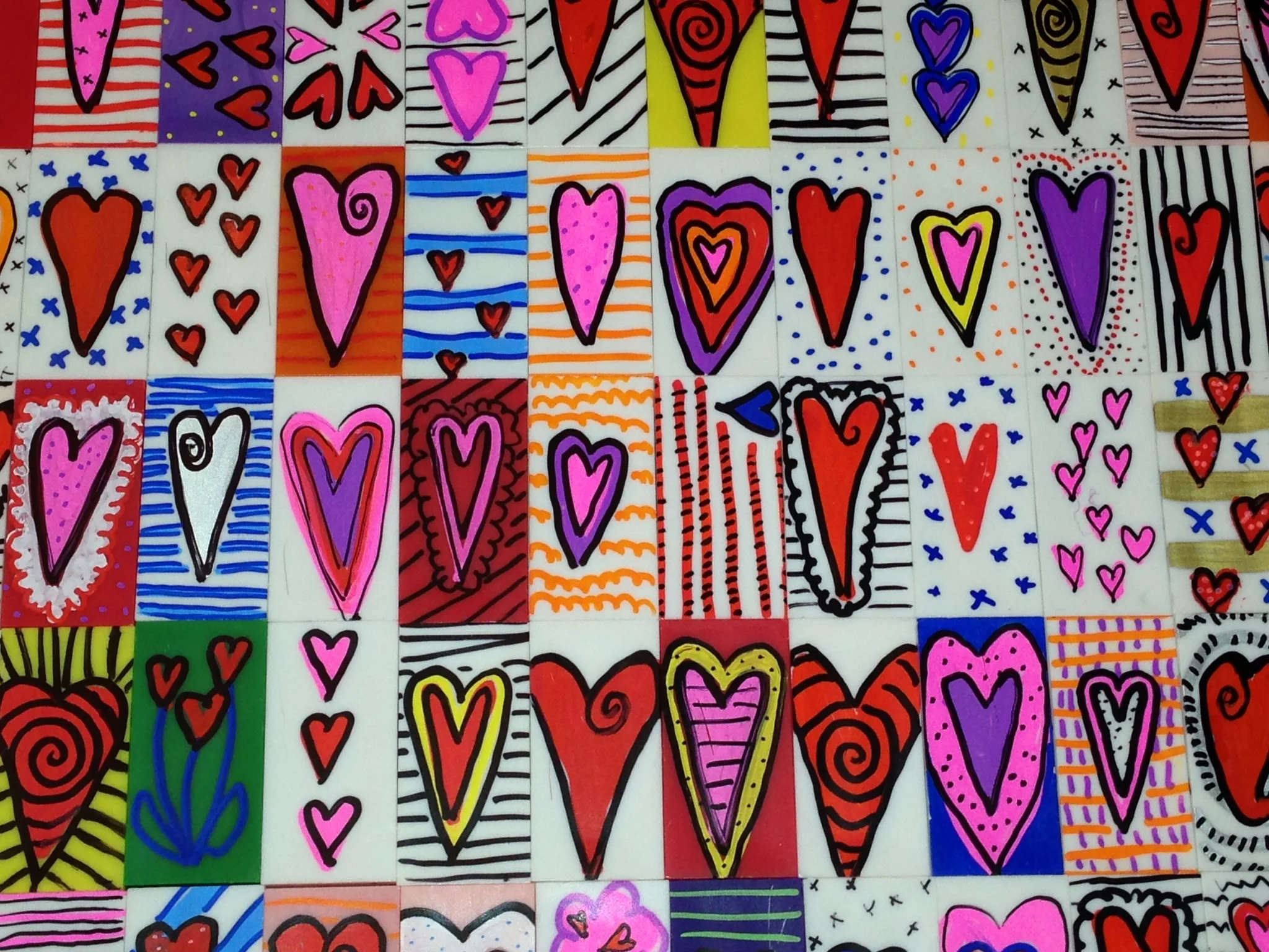 These luvbots are made using oil based markers and blank dominoes. I got the idea from an artist named Gary Hirsch .