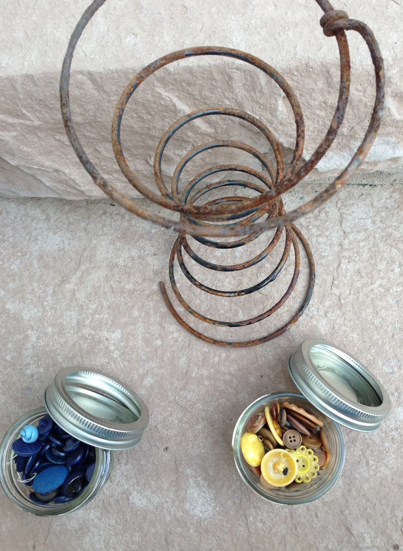 Here is my latest purchase from the Barn Sale. I use the buttons in several of the garden pieces I make. I was intrigued by the rusted bedspring and will look for a way to use it in my work!