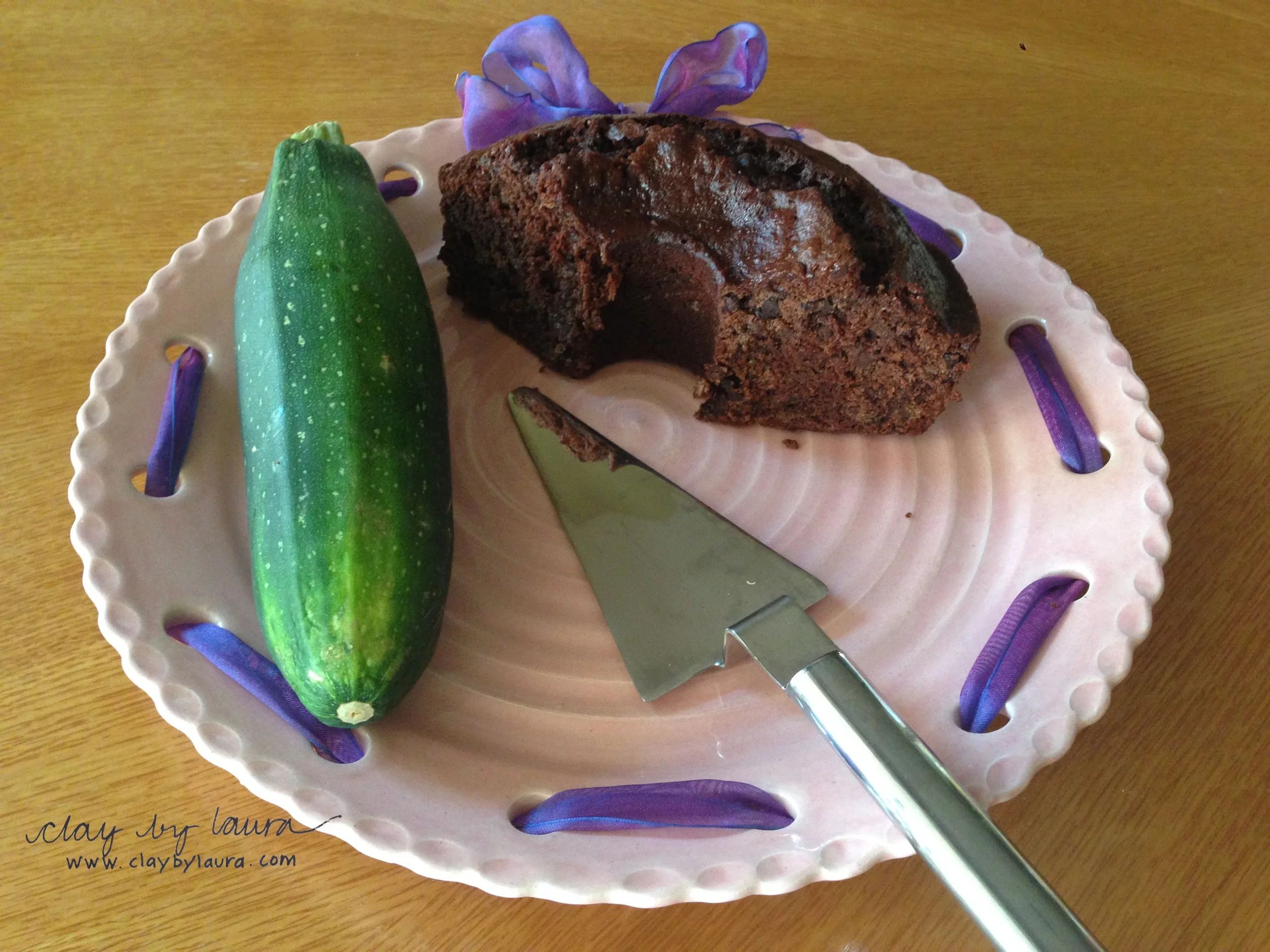 My neighbor Candace has a bountiful garden and I am the lucky recipient! Here is a chocolate zucchini cake I made sitting on one of my wheel thrown 'original' cake plates from 2003.