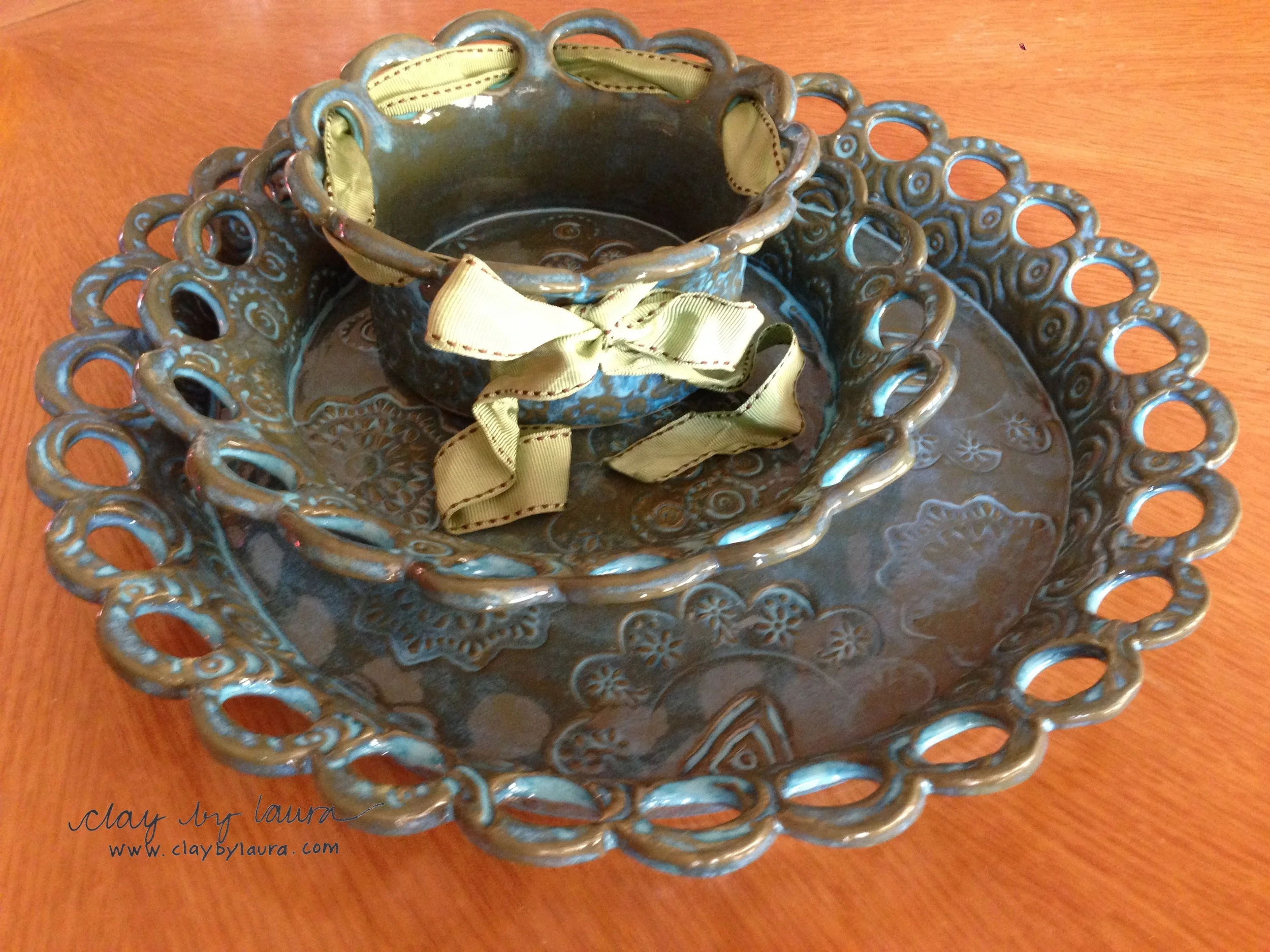 The ribbon plates and bowl are fresh out of the glaze kiln. This week I'll catalog them before I move on to the next project!