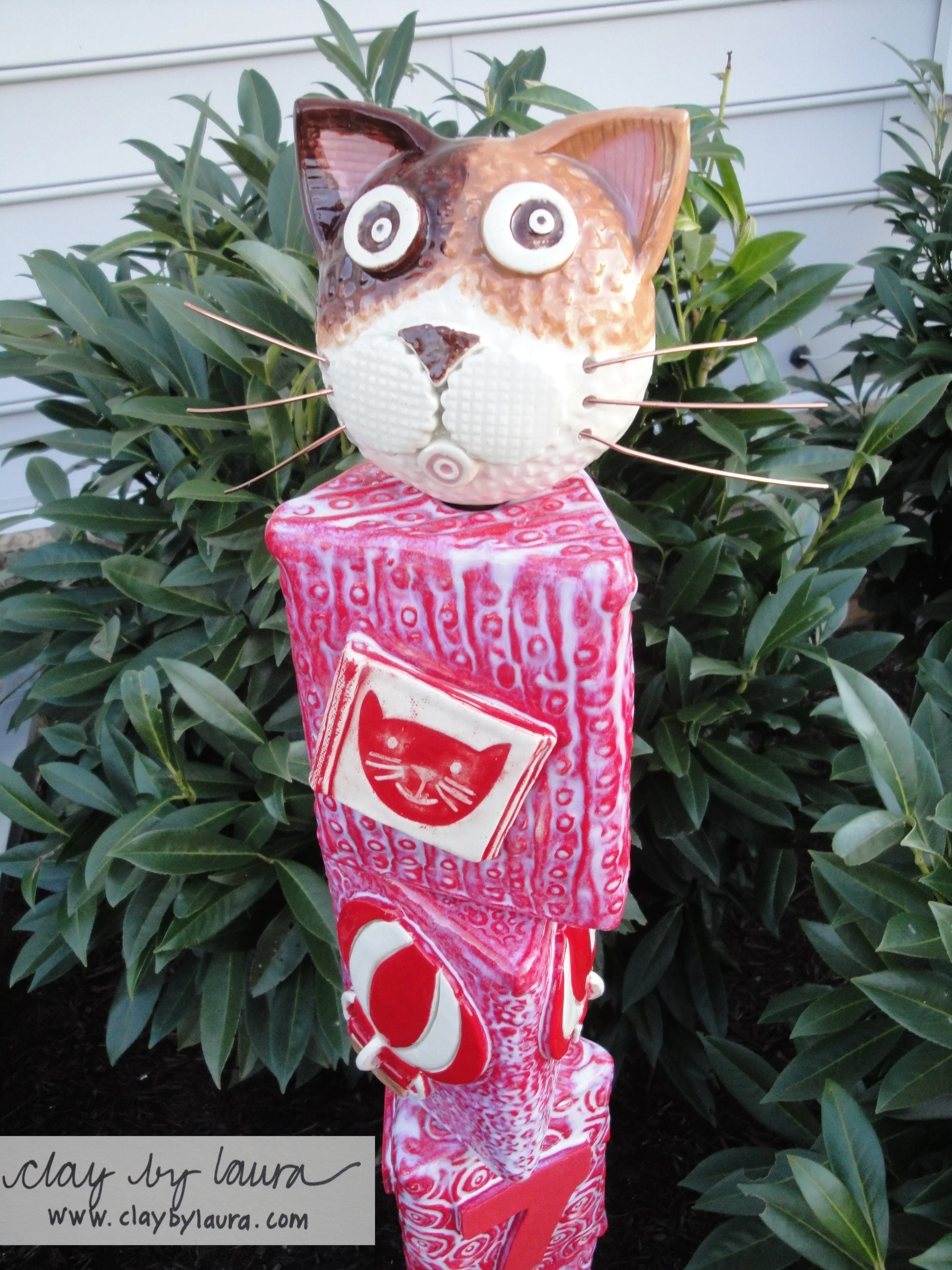 Totems are one example of creations that combine familiar and unfamiliar forms. This special address post was created for the author of the children's book KeeKee's Big Adventures . I knew I wanted to include an image of KeeKee, the hot air balloon and an image of a book along with the address numbers. I studied drawings of KeeKee and then got to work in the studio figuring out how to incorporate the images into a three dimensional format. 