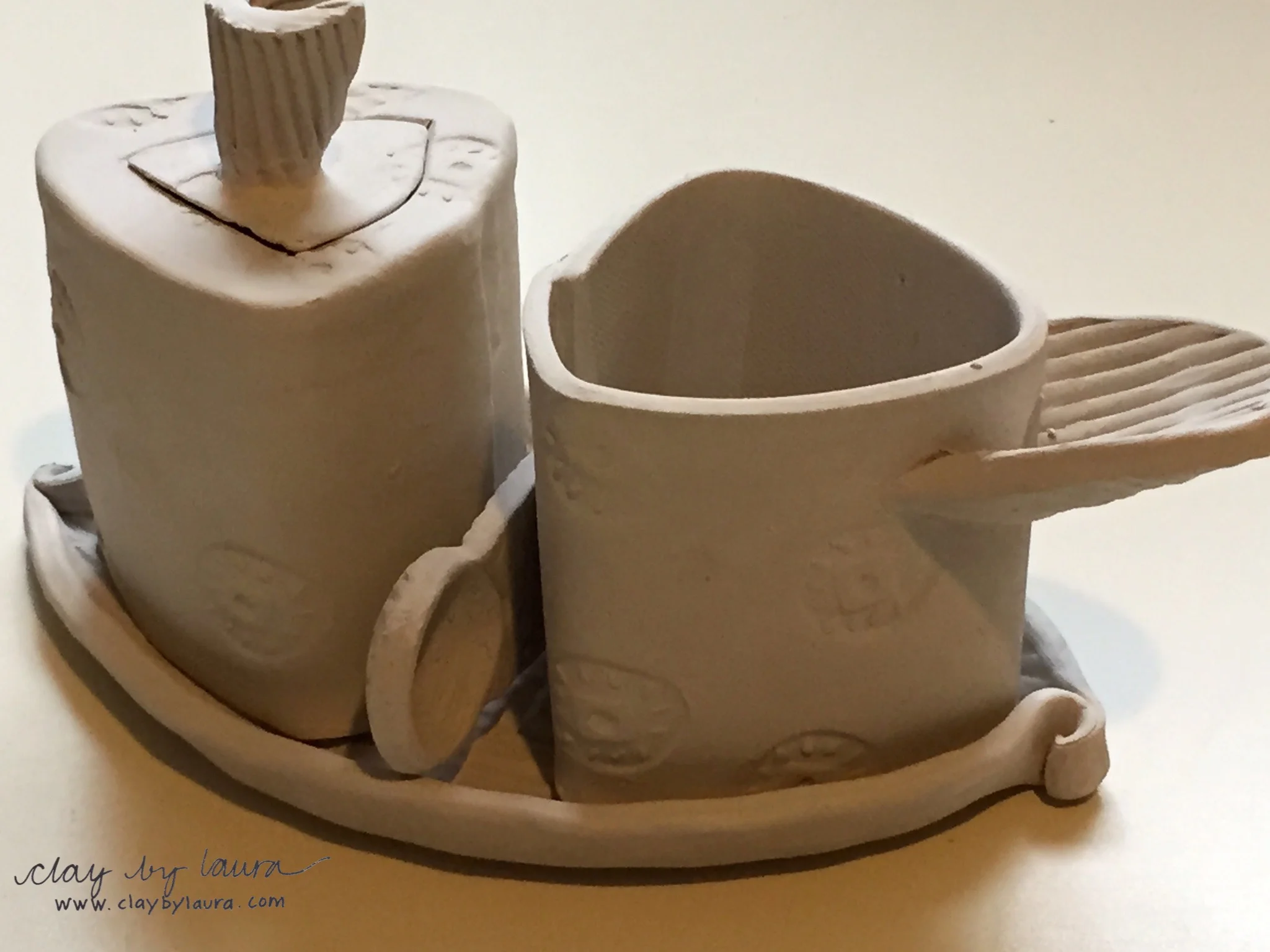 I made several of these sugar/creamers in the studio this week. I've added a spoon to the set.
