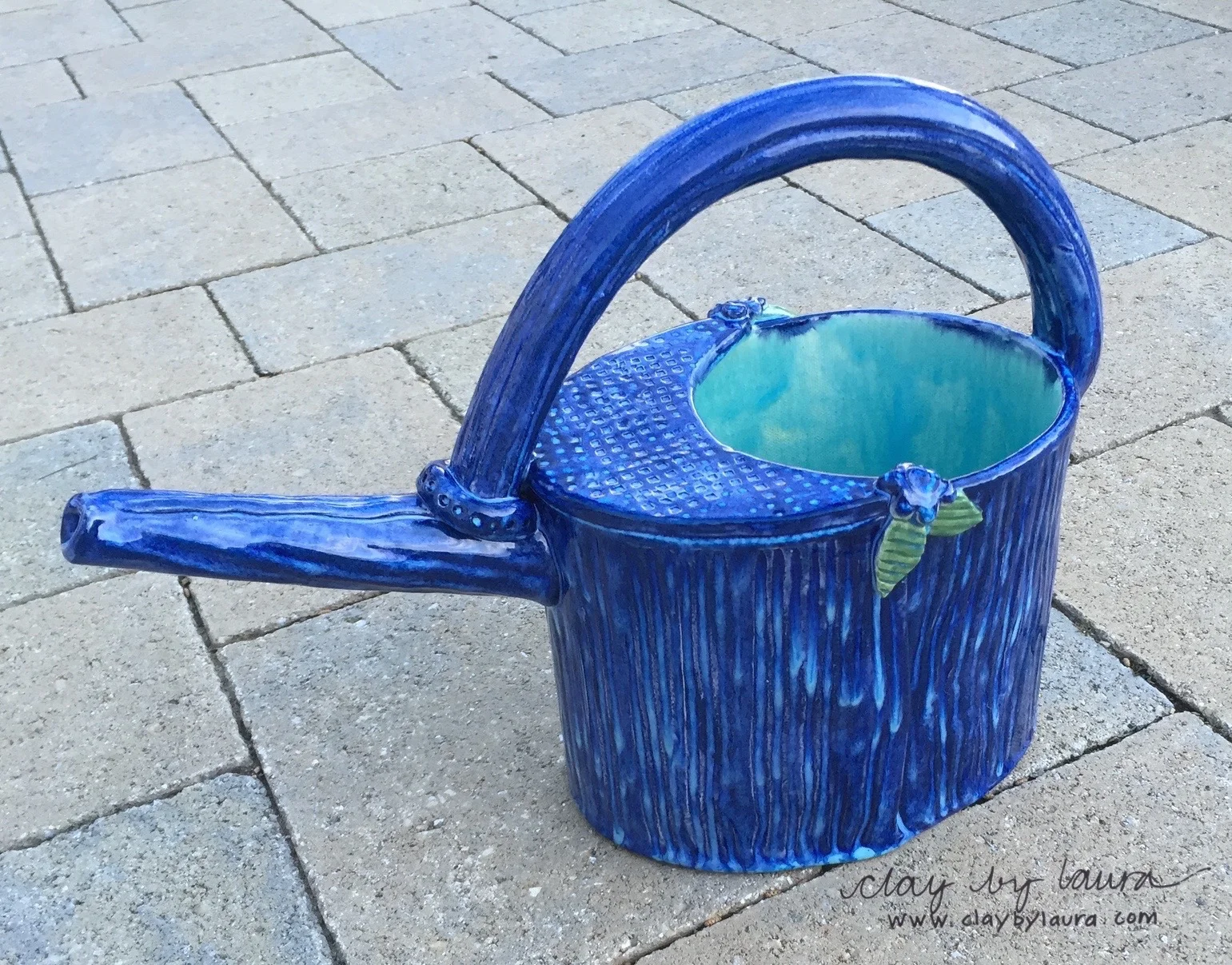 Cass Molander of Cedar Rapids, Iowa is the WINNER of the watering can giveaway!