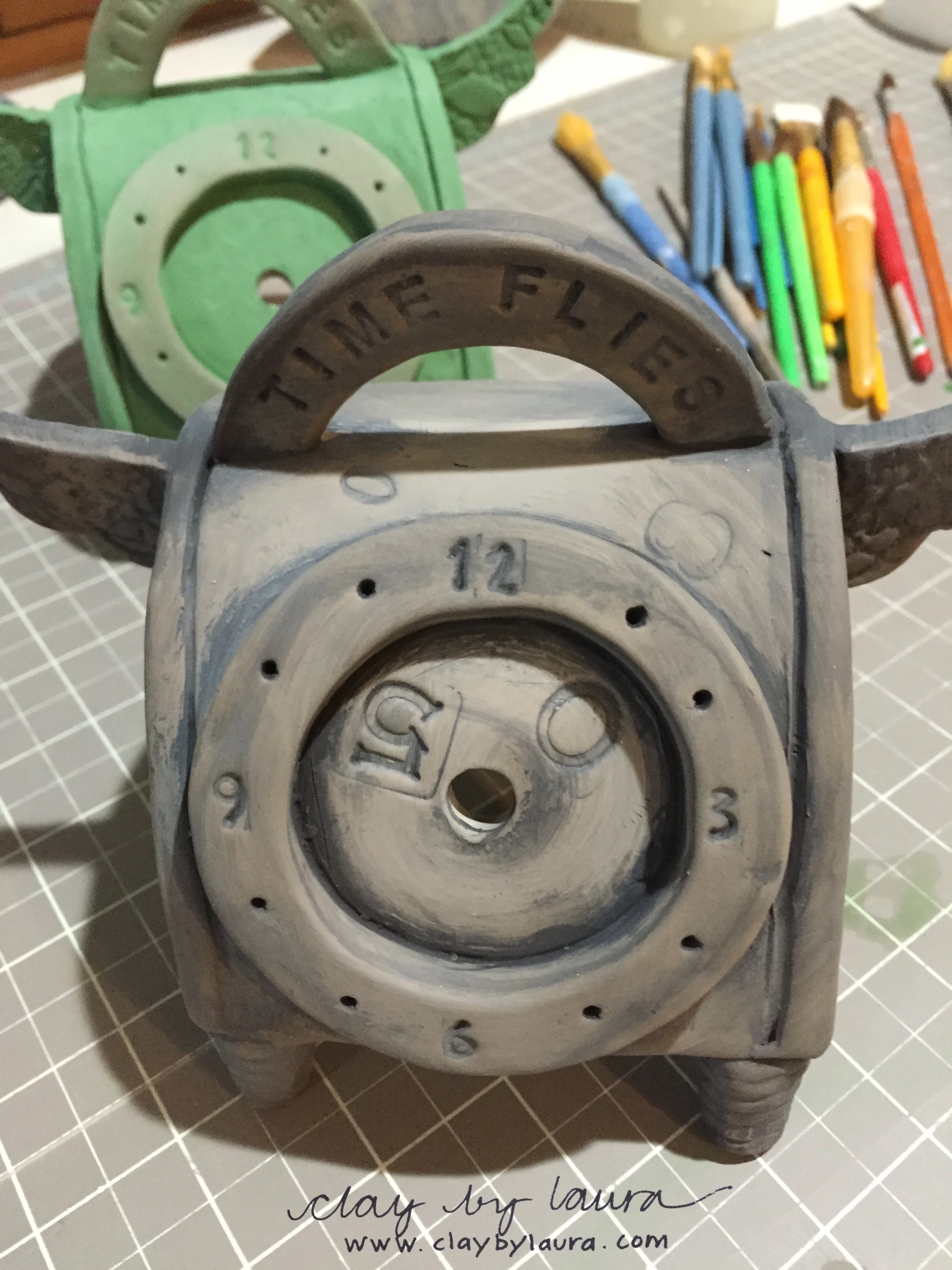 Clay also helps me stay connected to friends and family who have died and make donations to helpful community organizations. I've been able to create special urns for holding a loved-one's ashes. Additionally, I make a yearly rendition of an angel in honor of a friend who died long ago of breast cancer. Here's the angel-themed clock I am working on in the studio this week. These clay opportunities help me stay connected also.