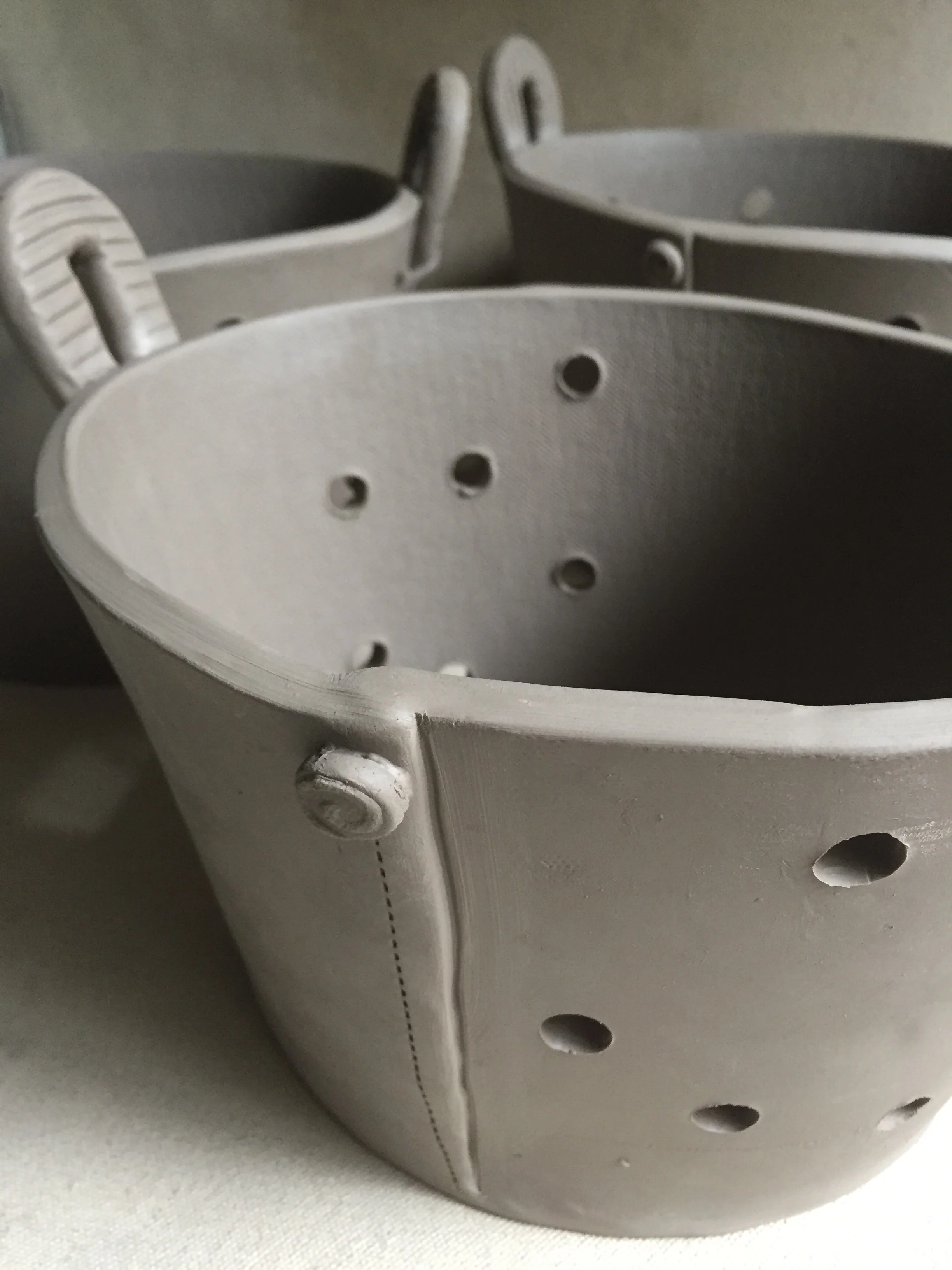 And here's the final result. I decided to use the holes as part of the design. Instead of spreading them all over the piece, I like how the cut-outs reveal themselves on just part of the front and back of the basket. I can see this being used to hold fruit or veggies on the counter or even mail collected by the front door. Do you have any other ideas of how this could be used? Click on the photo to let me know!