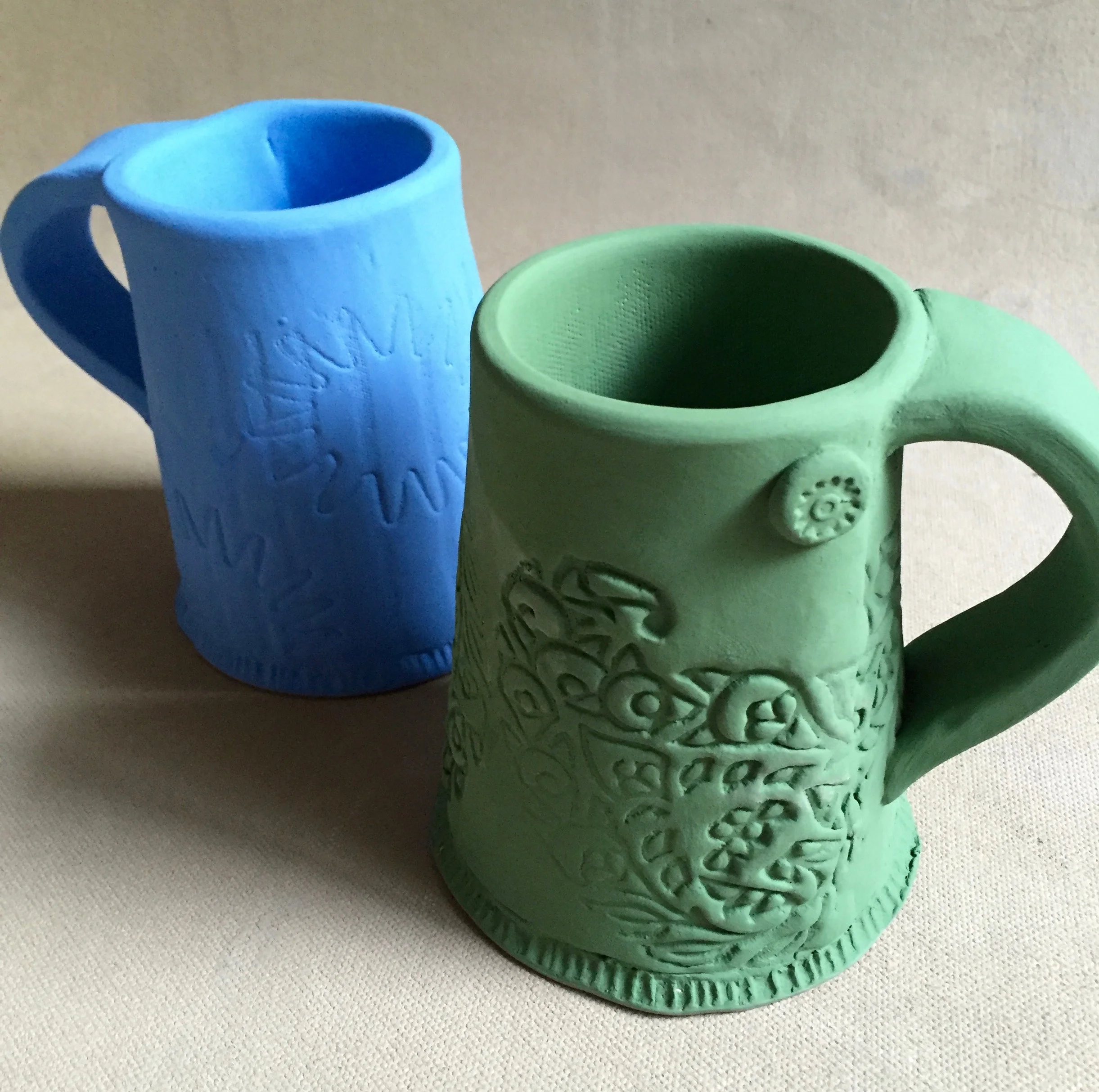 This is a new mug form for me. I chose to have a wider base and narrow top. This helps the functionality of the mug by keeping a hot beverage hot. 