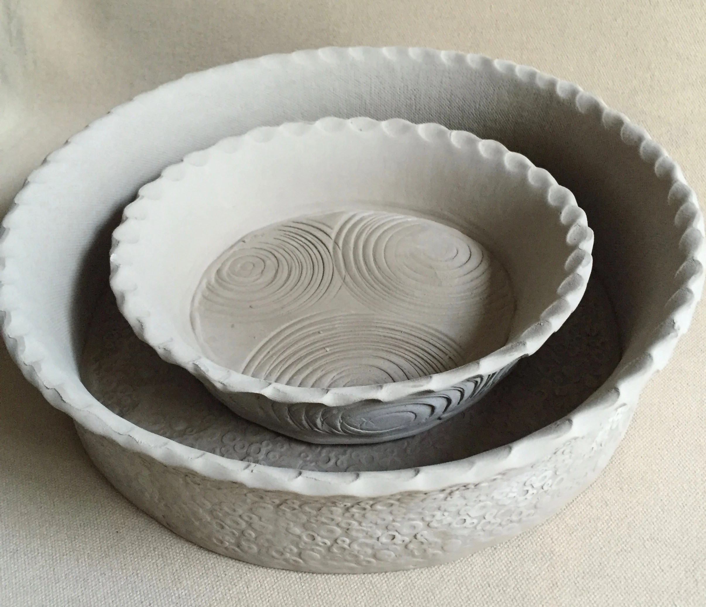 I've had a custom request for pie dishes. I based the design on some of the baking dishes I've made recently. Here, I started with the large deep dish size (9 inches diameter x 3 inches tall) and then decided to make a smaller personal pie size (5 inches diameter x 2 inches tall) version as well. I can see a beautiful quiche or blueberry pie in the large size. A baked brie might work well in the smaller size! 