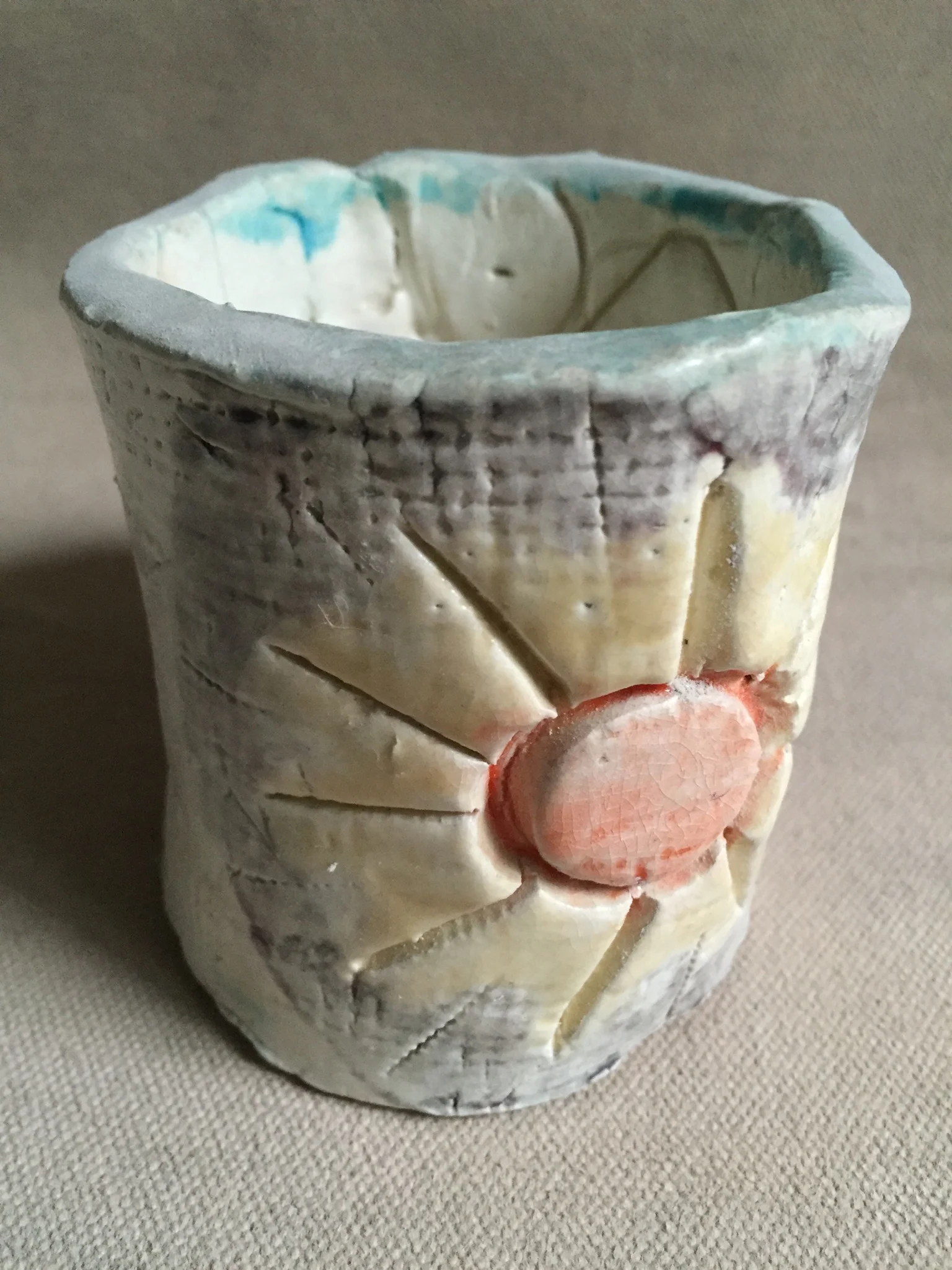 Here's one of the first pots I ever made in grade school. The imperfections have guided me toward improving my skills and appreciating its value.