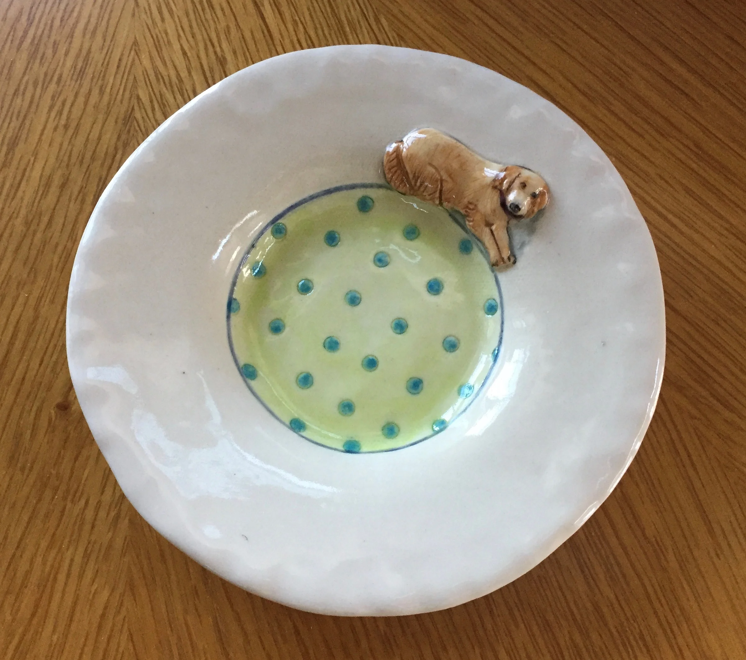 Of course I couldn't resist this incredibly sweet dish made by Laura Wilensky . The animal imagery on her pots is whimsical and fun! I'm already thinking up a custom piece I'd like her to create featuring the four golden retrievers I've had in my life!