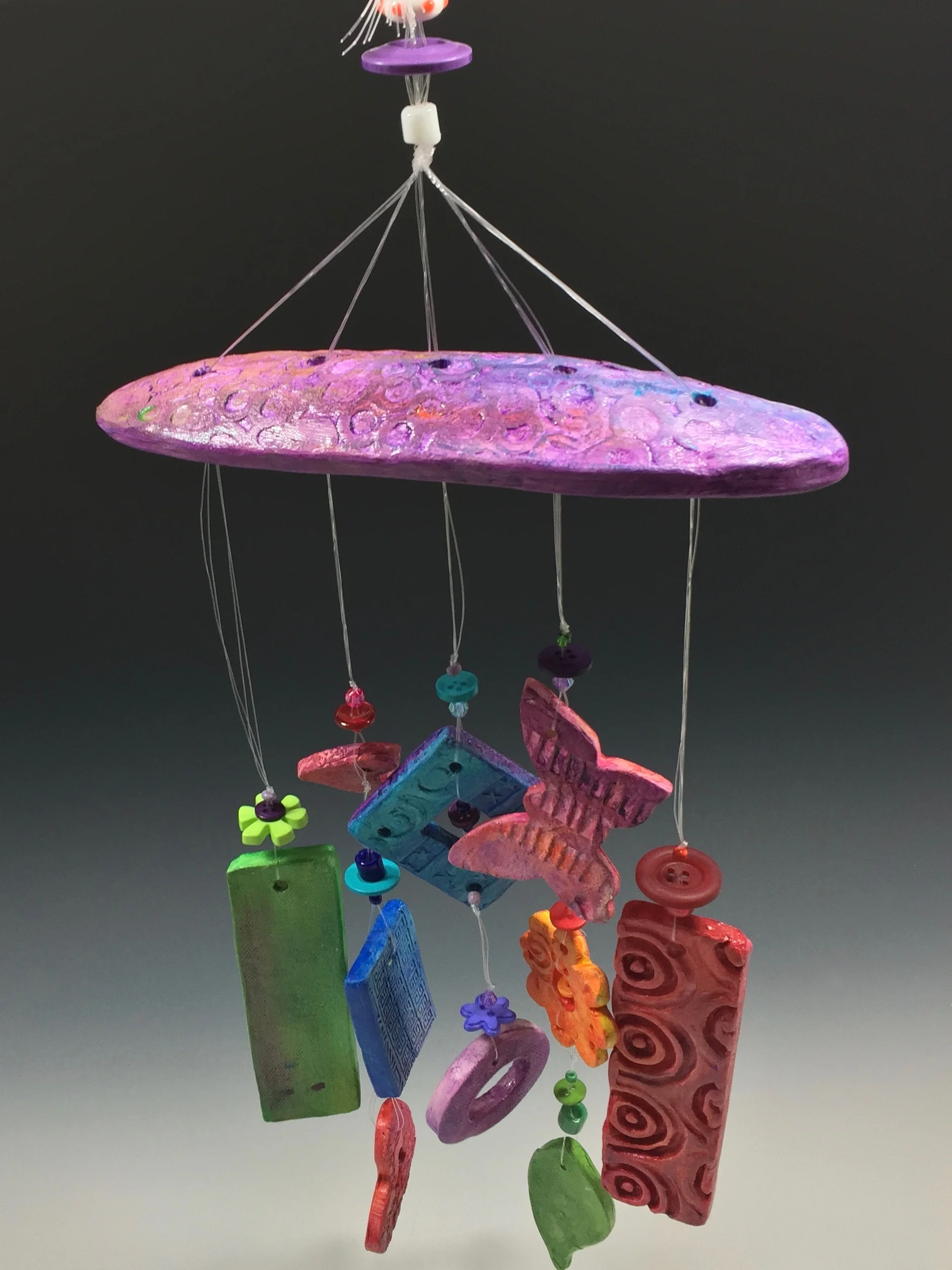A colorful wind chime will sing to you as the winds blow outside. Place one near a prominent window in your home. Every time you catch a glimpse of this bright decoration, you'll be reminded that spring and the warmer months are on their way! I'm currently working on some custom windchimes to memorialize favorite pets and family members. Let me know if I can create one for you! Click on the photo to let me know!