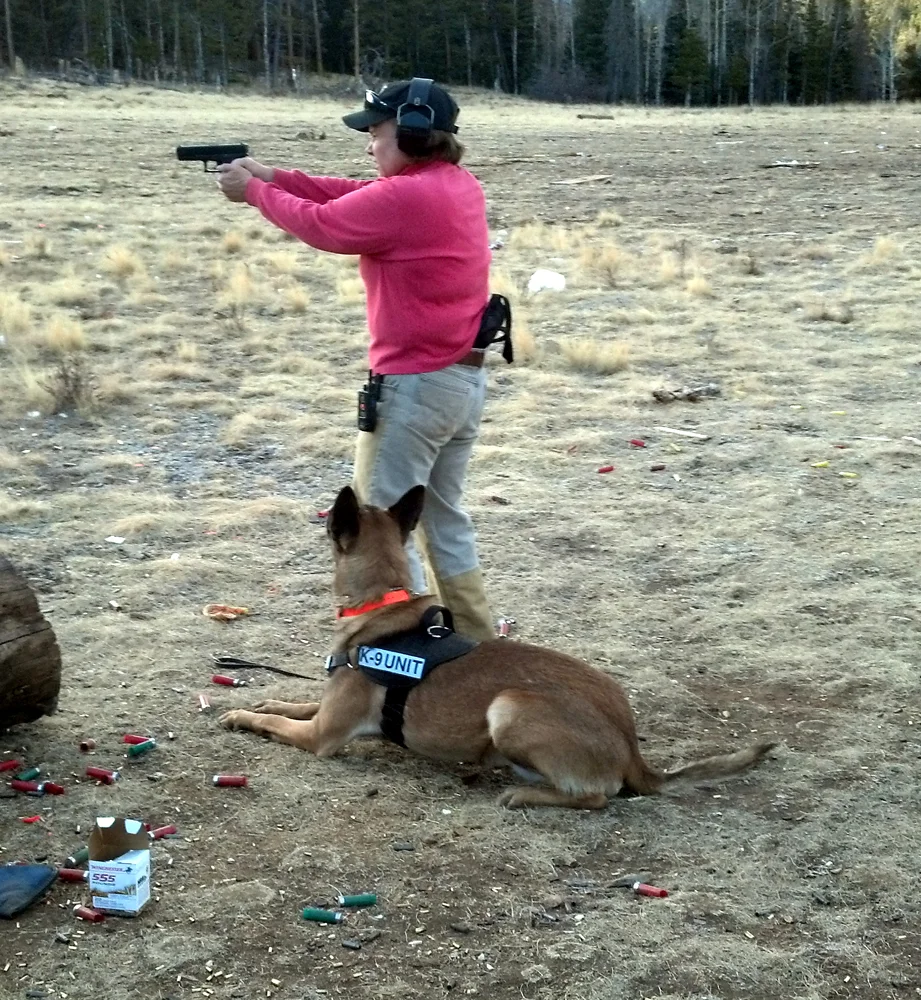 Allison working with Atreus - down under fire.  Atreus is working as a police dog in Springfield, MO.jpg