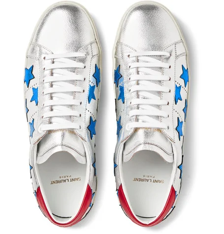 Leather appliqué stars elevate this low-top sneaker to statement maker. Perfectly patriotic when worn with red,white and blue but also perfect for all-year round when teamed with dark denim or to make an all white look pop. As these sneakers are on a metallic silver base - I'd love to see how these translate for evening (with a less strict dress-code of course). I'm thinking dark denim, white dress shirt, and blazer. Leave out the tie to complement the Rock and roll attitude of the trainers. 