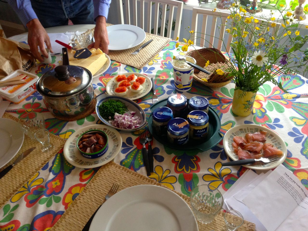Traditional Swedish midsummer lunch with herring and boiled potatoes, among other things