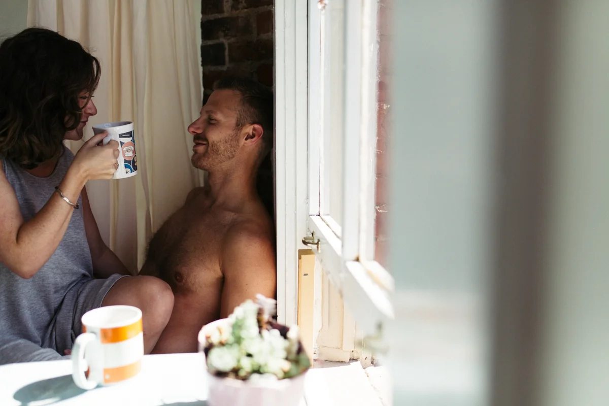 Couple happily talking intimate at-home engagement, Victoria BC