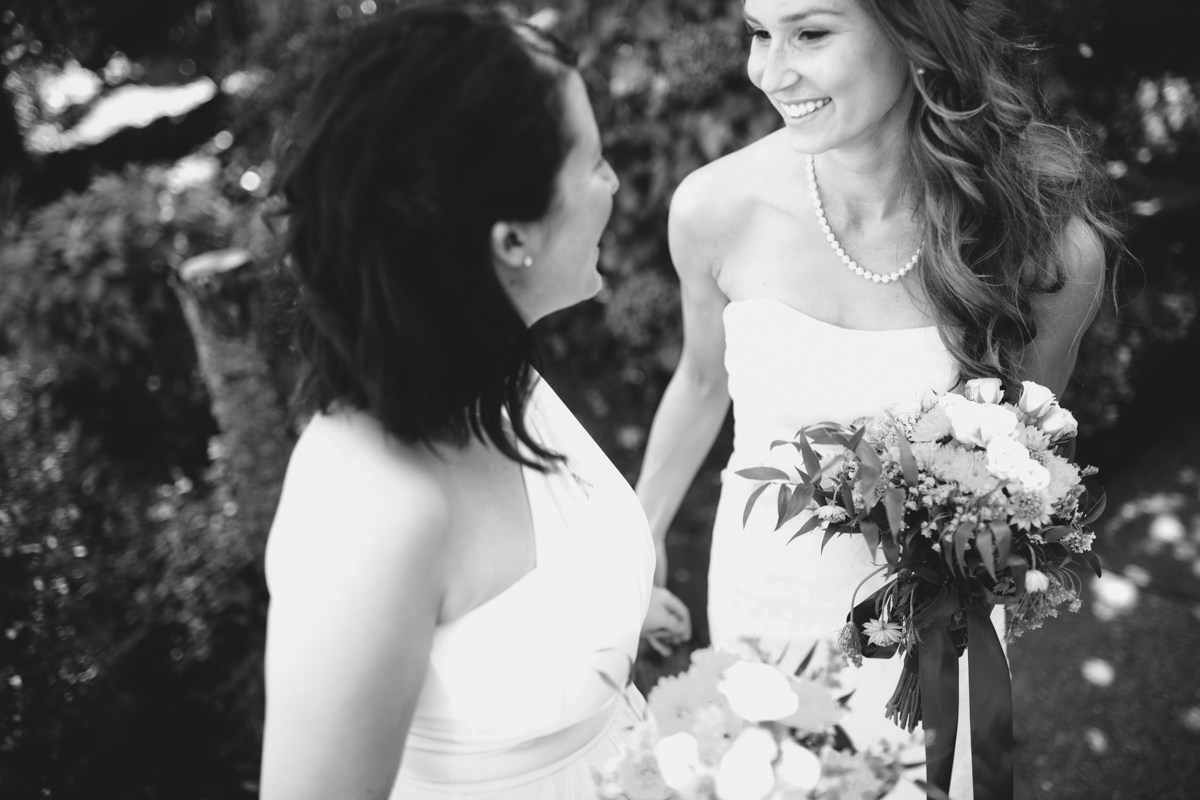 The Bride and Bridesmaid talking King Francis Park Forest Wedding Ceremony Vancouver Island