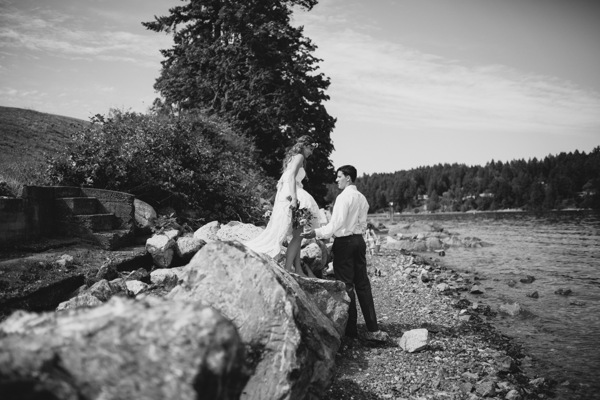 Photo of the newly wed Bride and Groom alongside the bay King Francis Park Forest Wedding the Guild Vancouver Island