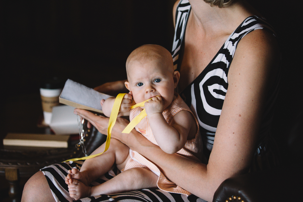 A baby holding a yellow ribbon King Francis Park Forest Wedding Ceremony Vancouver Island