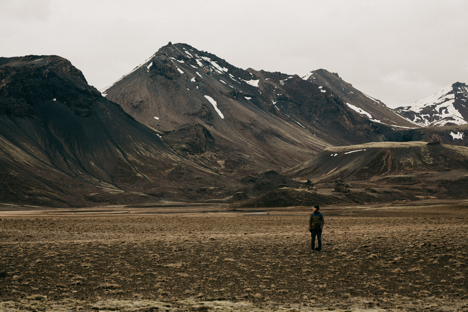 man in mountain valley iceland
