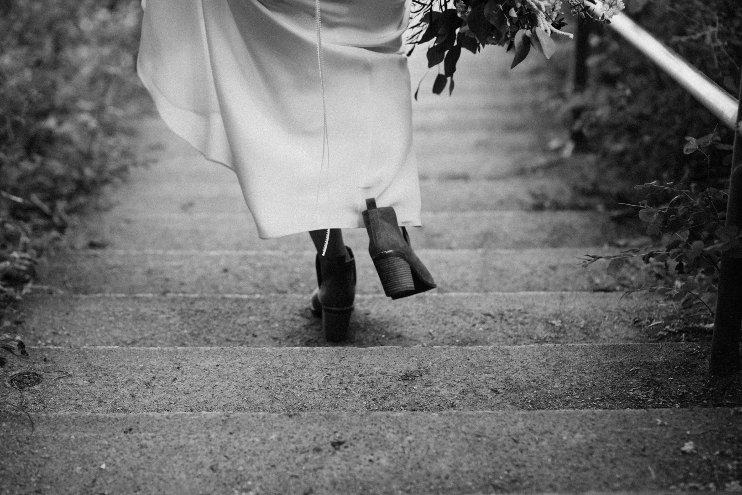 bride walks down stairs to Mount Doug beach, Victoria elopement photographer