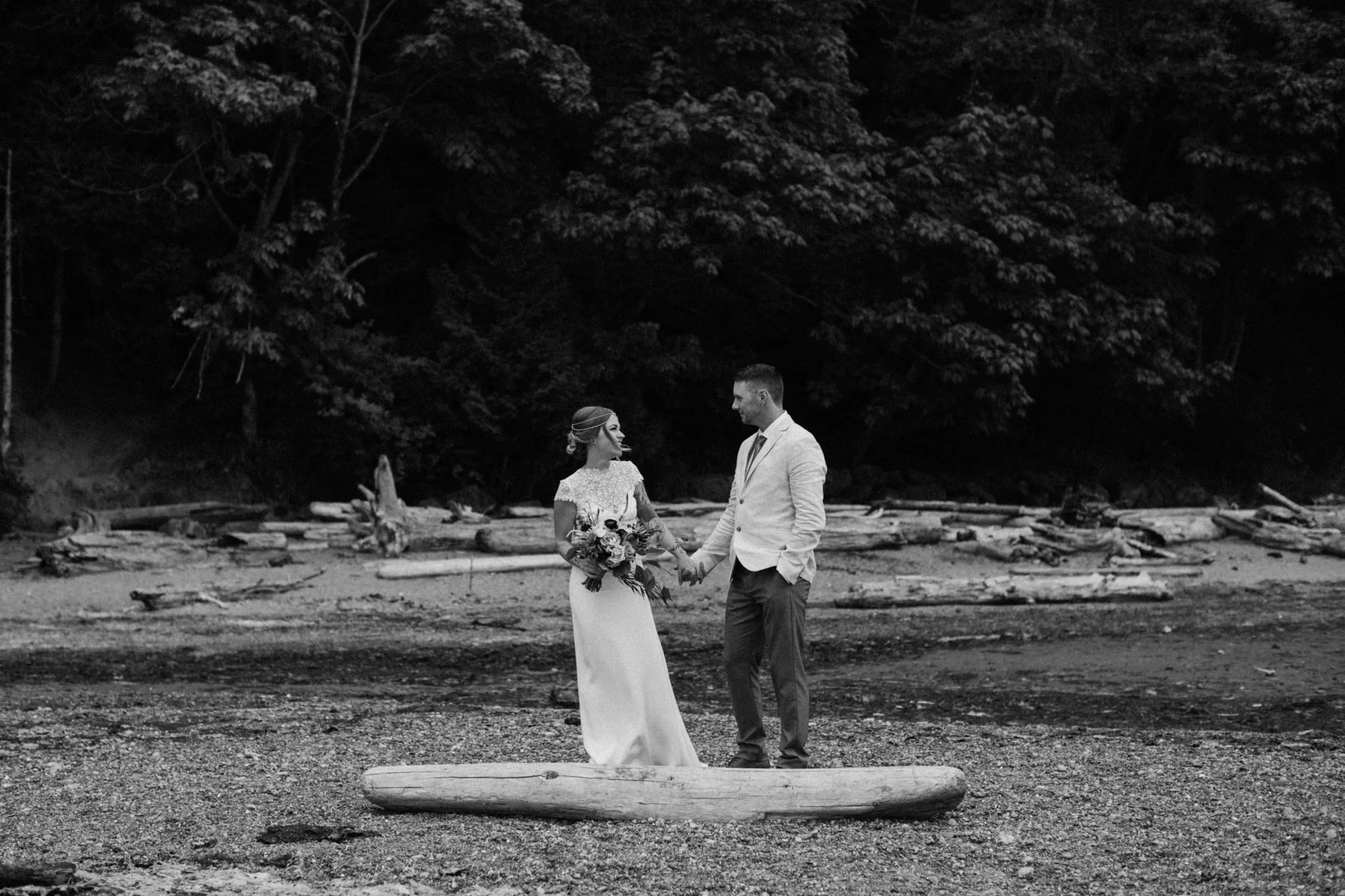 bride and groom hold hands on beach, west coast elopement