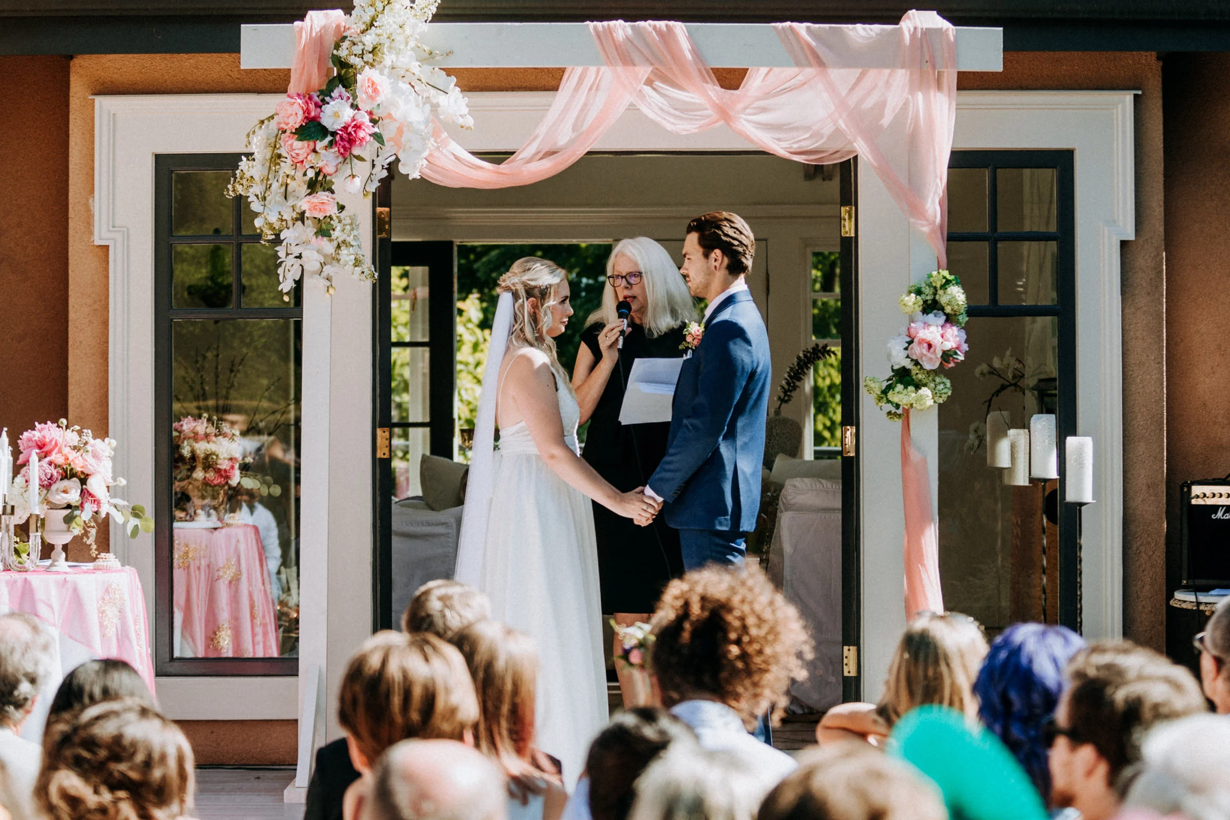 bride and groom exchange vows West Vancouver backyard wedding photographer