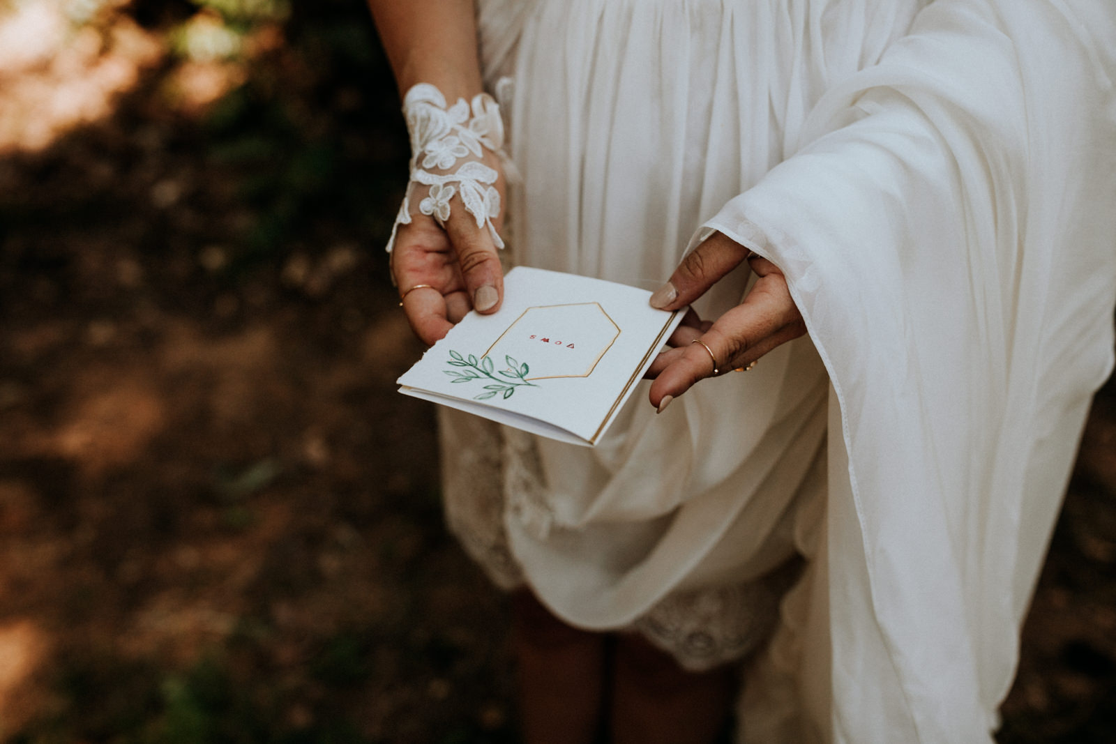bride holds vow book at getting ready Port Alberni wedding Photographer