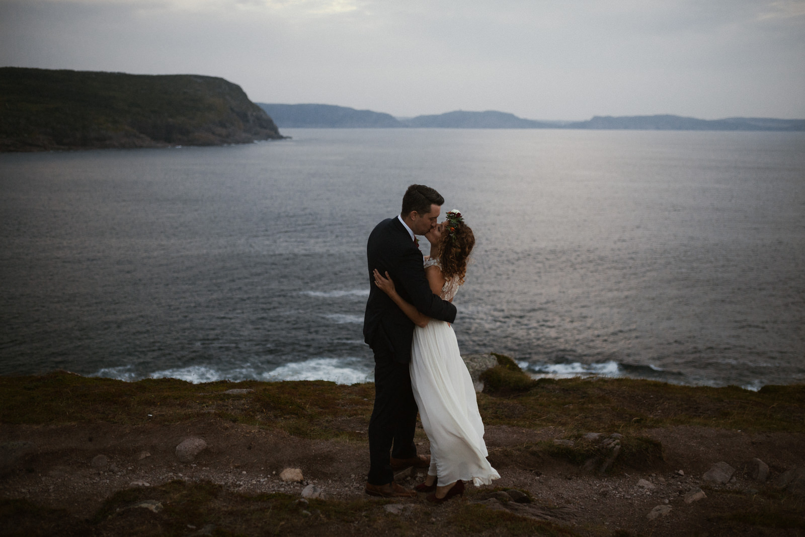 couple kisses cape spear newfoundland elopement photographer