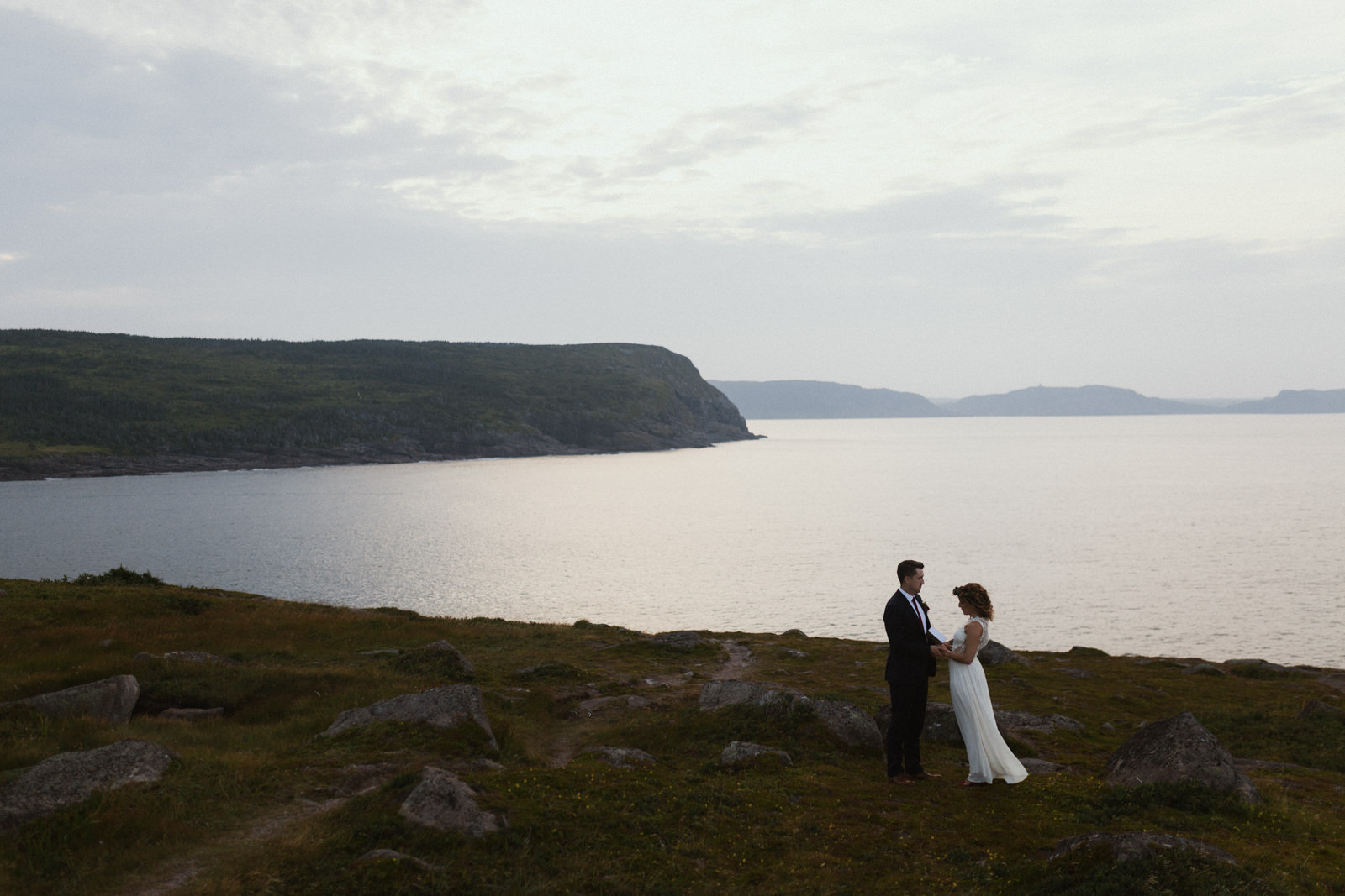 couple exchanges vows, cape spear newfoundland elopement photographer