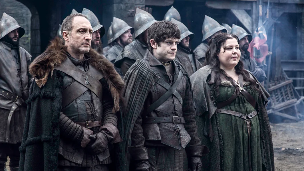 0
0
1
18
107
HBO
1
1
124
14.0
Normal
0
false
false
false
EN-US
JA
X-NONE
/* Style Definitions */
table.MsoNormalTable
{mso-style-name:"Table Normal";
mso-tstyle-rowband-size:0;
mso-tstyle-colband-size:0;
mso-style-noshow:yes;
mso-style-priority:99;
mso-style-parent:"";
mso-padding-alt:0in 5.4pt 0in 5.4pt;
mso-para-margin-top:0in;
mso-para-margin-right:0in;
mso-para-margin-bottom:8.0pt;
mso-para-margin-left:0in;
line-height:107%;
mso-pagination:widow-orphan;
font-size:11.0pt;
font-family:Calibri;
mso-ascii-font-family:Calibri;
mso-ascii-theme-font:minor-latin;
mso-hansi-font-family:Calibri;
mso-hansi-theme-font:minor-latin;}
Michael McElhatton as Roose Bolton, Iwan Rheon as Ramsay Bolton and Elizabeth Webster as Walda Frey. Photo Credit: Helen Sloan/HBO