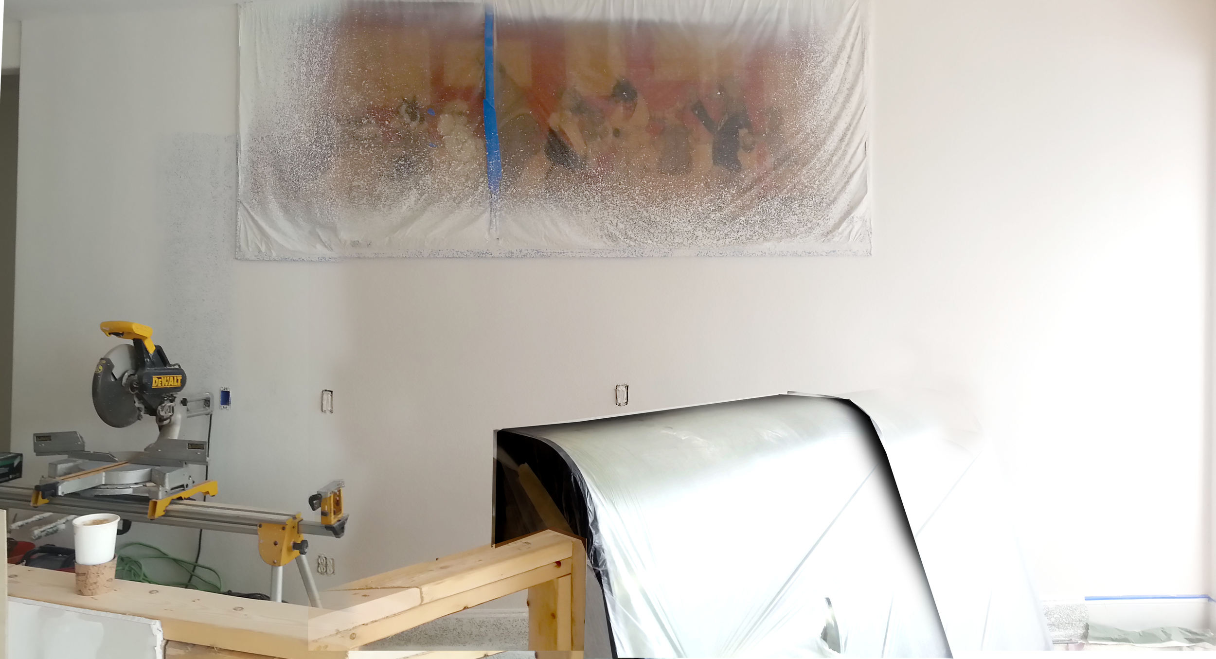 The Red Dogs, all covered up safe and sound. When we started the remodel we took an old layer off of this wall and that beautiful mural was behind it.