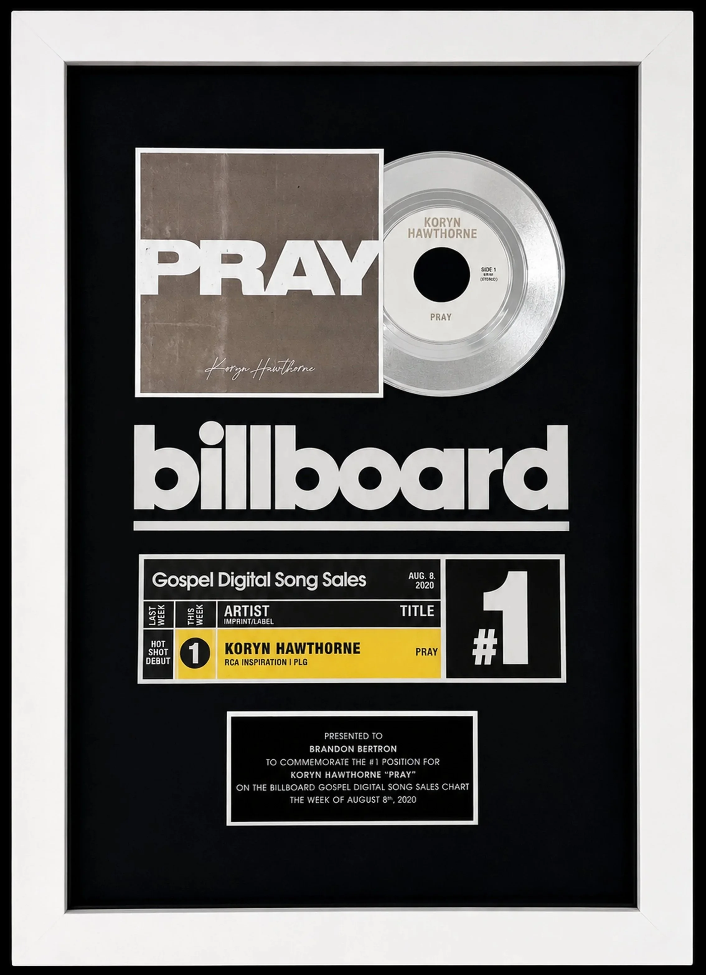A framed Billboard Music Award plaque featuring Koryn Hawthorne's song 'Pray' for Gospel Digital Song Sales on August 8th, 2020, with a silver disc and a plaque with various chart details. Presented to Brandon Egerton.