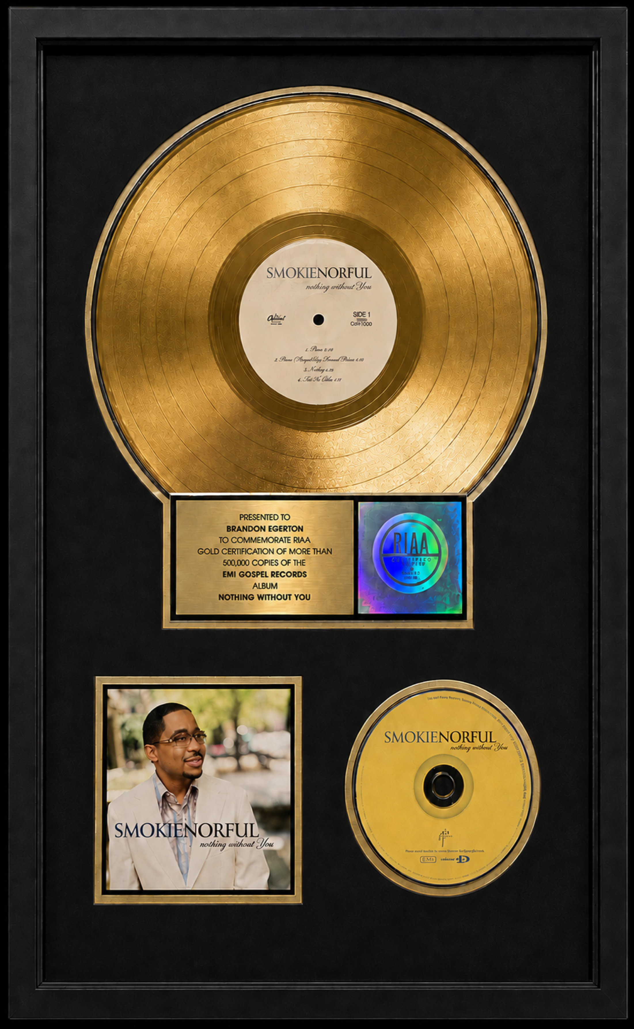 Gold record plaque for Smokie Norful's album 'Nothing Without You,' featuring a photo of the artist and a certification label from RIAA. Presented to Brandon Egerton.