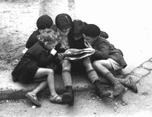 Children Reading Newspaper