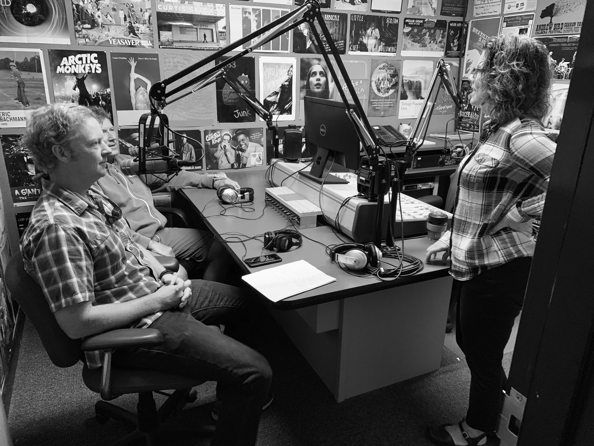 Jenny Lake District Ranger Scott Guenther (front left) and Jenny Lake Climbing Ranger Jack McConnell speak with “The Fine Line” host Rebecca Huntington at KHOL studios in Jackson, Wyoming. Photo: Matt Hansen