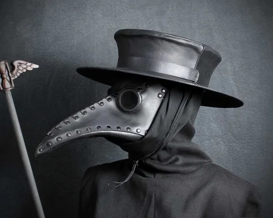 Reproduction of the uniform of a 17th-century plague doctor. The "beak" contained things like lemon balm, cloves, myrrh, rose petals and even laudanum, to protect the doctor from the "miasma" (bad air) that supposedly caused plague.