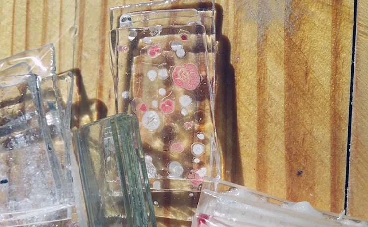 Testing laboratory glass slides with specimen wells, Glassline brand paints, white glue + mica flakes, Uroboros powdered colors and handmade sheet glass (blown cylinders from Spectrum 96).