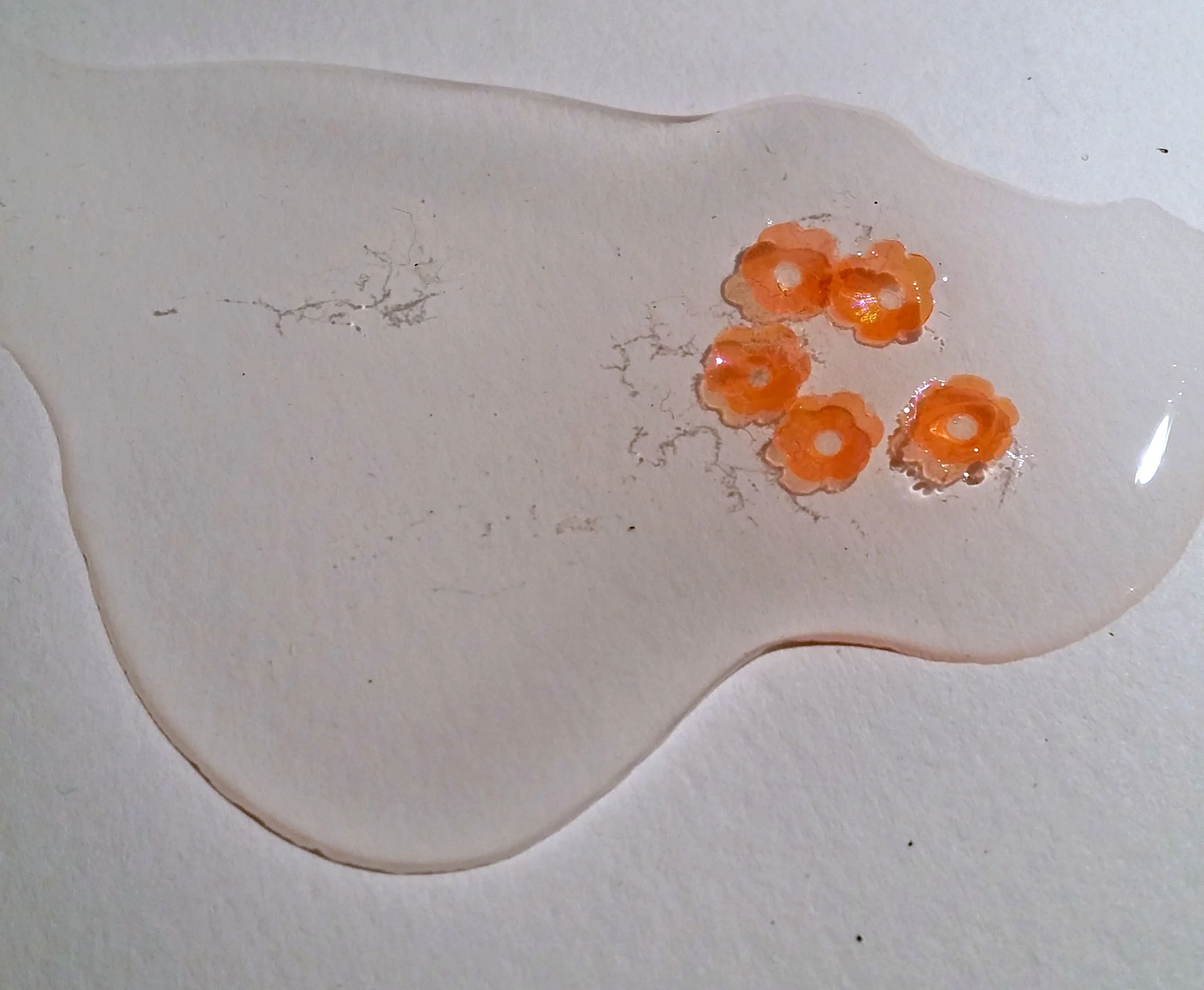 Dust from an old cup trapped in the solution.