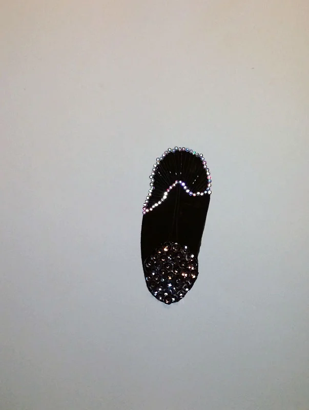 Close-up of the only thing on the wall. Flat black gouache, crystals and sequins.