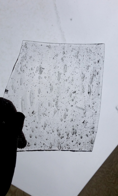 Handmade sheet glass from pre-2010, filled with air pockets and imperfections.